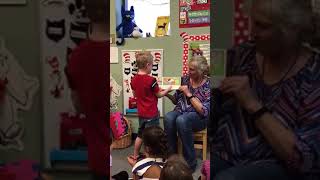 Apraxia and Autism 5 year old reading to his class