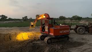 Digging and Loading Soil on Trolley