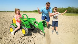 Using our kids tractors to dig dirt and save a stuck real tractor | Tractors for kids