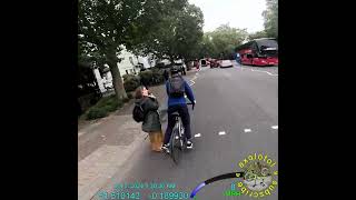 Cyclist jumps the red light and almost runs into a pedestrian.