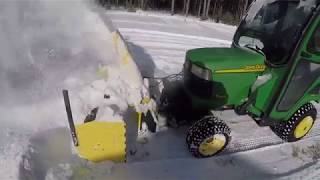 Teaching Junior how to snowblow John Deere X585