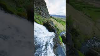 beautiful view of water fall in green mountains