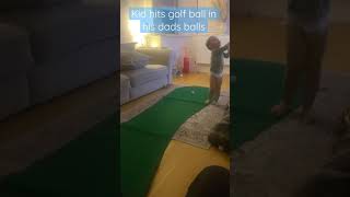 Kid hits golf ball into his dads balls