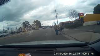 Man just starts walking in the road with his shopping cart