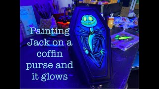 painting a coffin purse with a semi familiar skeleton on it