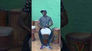 M'Bemba Bangoura playing a Wula Hardwood Special Piece Djembe