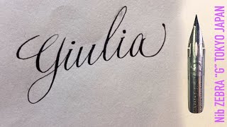 With a Japanese sharp pen, ZEBRA G, I write the name Giulia in calligraphy handwriting.