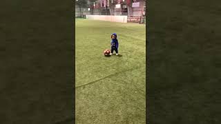 One year old dribbles the ball