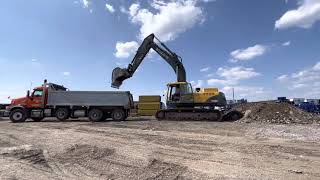 Volvo ec360 loading trucks