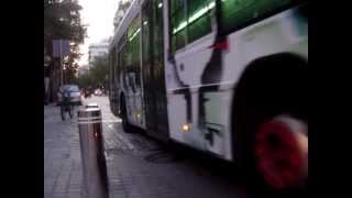 Bus riding through a raised table junction in Seville