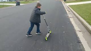 Kid wipes out on Scooter!!!