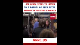 Joe Biden stops to listen to a barrel of beer after remarks on investing in America…