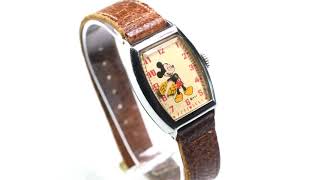 A MICKEY MOUSE STRAP WATCH