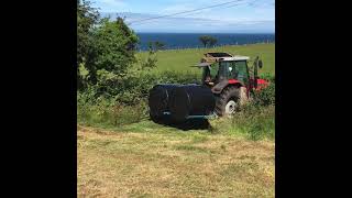 Massey Ferguson 6290 and 390t lifting silage bales