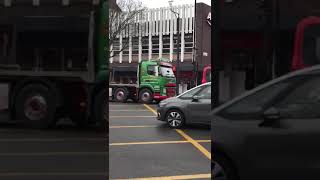 Green & red Volvo flat bed Semi truck. 460 model