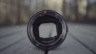 Close up of professional camera lens with opened aperture. Action. Technical features of lens for