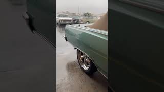 Fuel injected Chevelle in a rainy day.