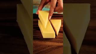 cutting of cheddar cheese