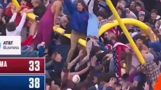 KANSAS UPSETS 6. OKLAHOMA! Kansas fans storm the field and takes the goal post with them!