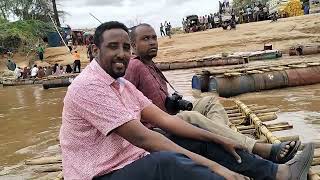 The Men With Cameras Cross Over River Daua To Ethiopia- Adan Afar And Ahmed Sharks