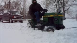 Plowing snow with the John Deere 111