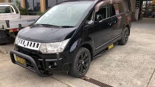 Mitsubishi Delica D5 with nudge bar and side bars