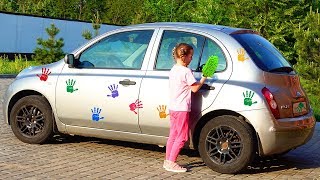 Ulya playing car wash with cleaning toys