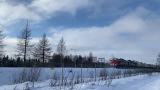 Russian Railways freight train returning home with empty tanker wagons.