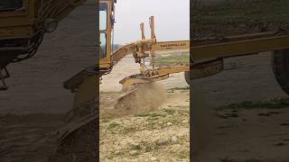 Cat 140G Motor Grader: Working Hard on the Job"