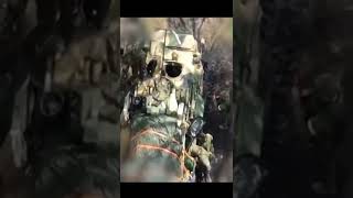 Russian troops and a BTR-82A APC concealed next to buildings blasted from above by dropped munitions