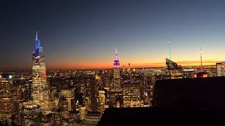 Time lapse sunset behind the Empire State Building from the top of Rockefeller center 4k