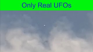 UFO hovers along the clouds over Oldham, UK.