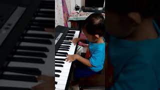 Aiman playing piano