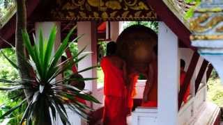 Monks drumming on Phousi Hill in Laos