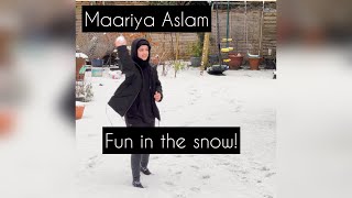 Snow! Hafiza Maariya has fun with her sister.