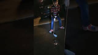 smashing ice with a golf club