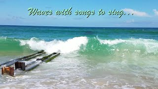 Crystalline blue-green waves roll in on Nags Head, North Carolina