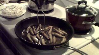 How-to: Cook Italian Feast of 7 Fish Christmas Eve Dinner - Patrick Frying Smelt (tiny clip)