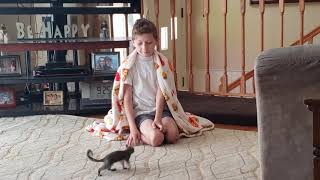 My son playing with our baby rescue squirrel!