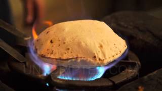 Bread Cooks on Open Flame (Stock Footage)