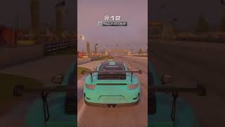 Grid Porsche GT3 Rs cornering and breaking into first place