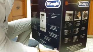 Unboxing Delonghi Magnifica and inspecting item for damages