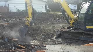 Yanmar SV 100 Pulling up old foundation for recycling