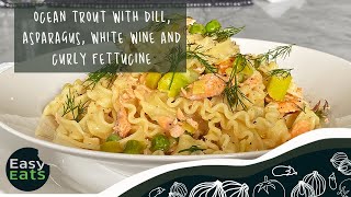 Ocean trout with dill, asparagus, white wine and curly fettucine