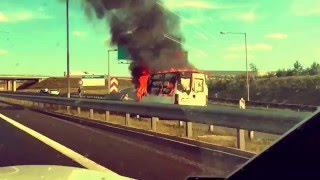 Car fire on highway. Driver rescued?