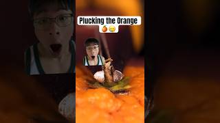 Plucking the Orange! #shorts #reaction #orange