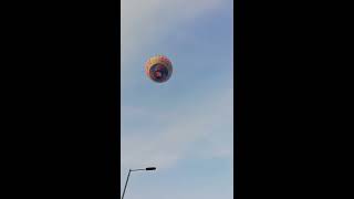 Beautiful hot air balloon silently floating over me in England