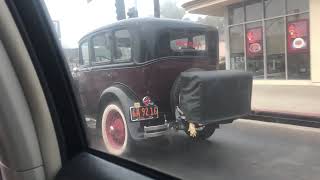 Classic (old) car in traffic - California