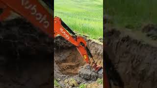 excavator digging a hole