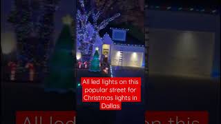 Wrapping a tree with Christmas lights In Dallas on Robin Street #colorful #twinkle #multi #treewrap